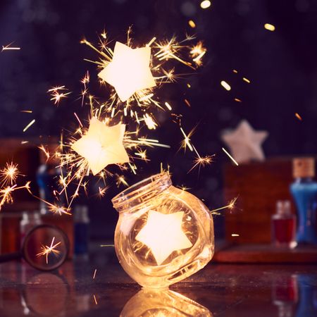 Illuminated composition of bright stars and jar