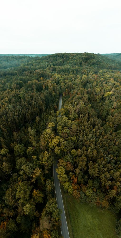 Drone aerial view with road passing through Germany