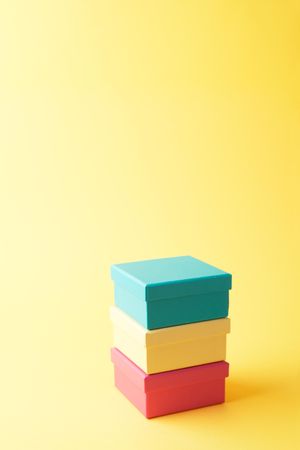 Three stacked boxes on yellow background