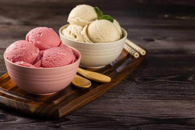 Bowls with strawberry and vanilla ice cream.