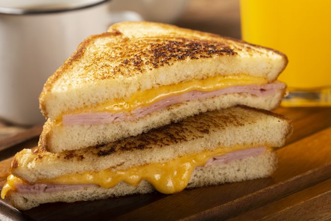 Grilled ham and cheese. Sandwich with cheese and ham on grill.