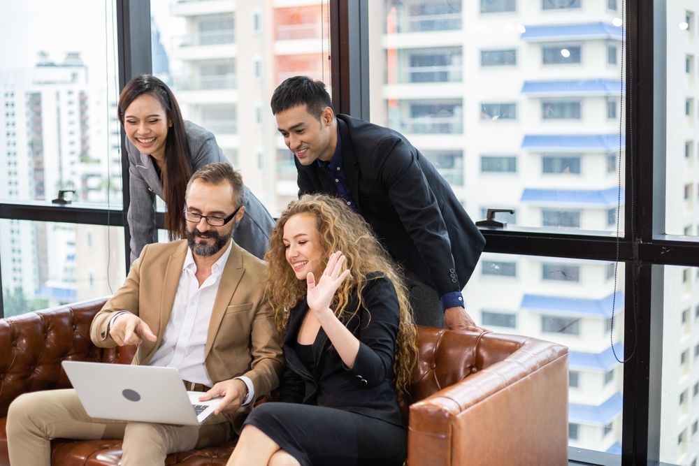 Group of smiling business people in video call together