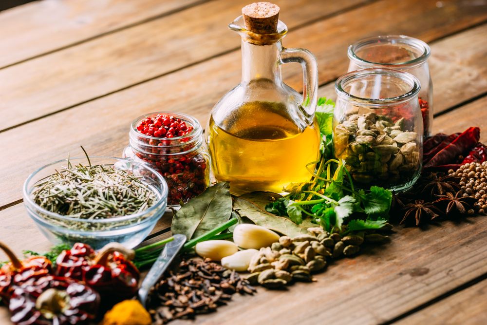 Spices and oil on table