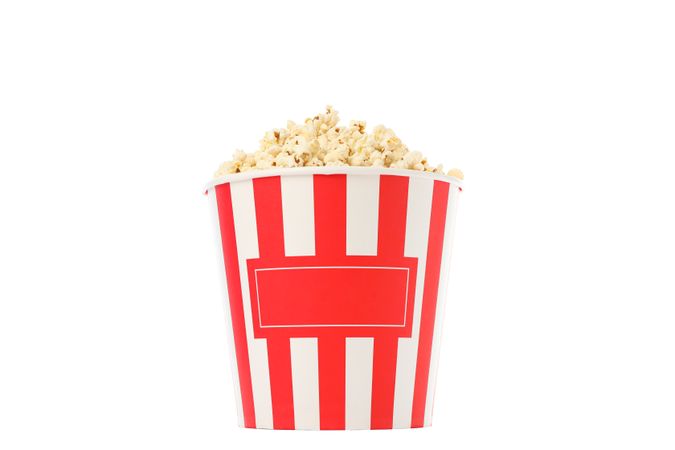 Striped bucket with popcorn isolated on plain background