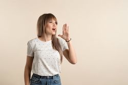 woman posing in pastel background