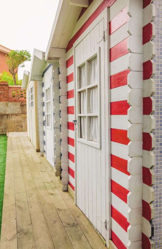 Beach striped huts in a home garden