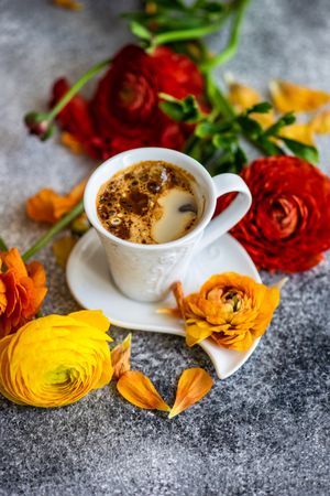 Summer floral card with espresso surrounded by fresh flowers