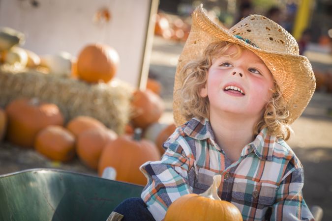 Little Boy in Cowboy Hat at Pumpkin Patch