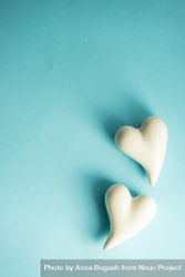 Ceramic heart ornaments on pastel blue background bYqqNg