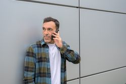 Young man talking on smartphone