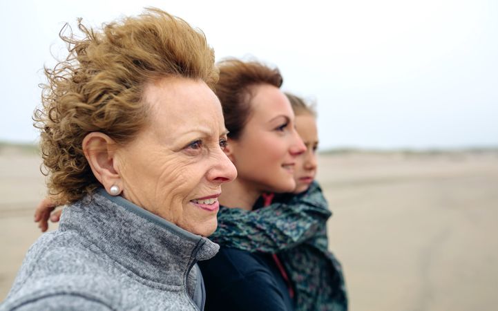 Three generations looking at sea