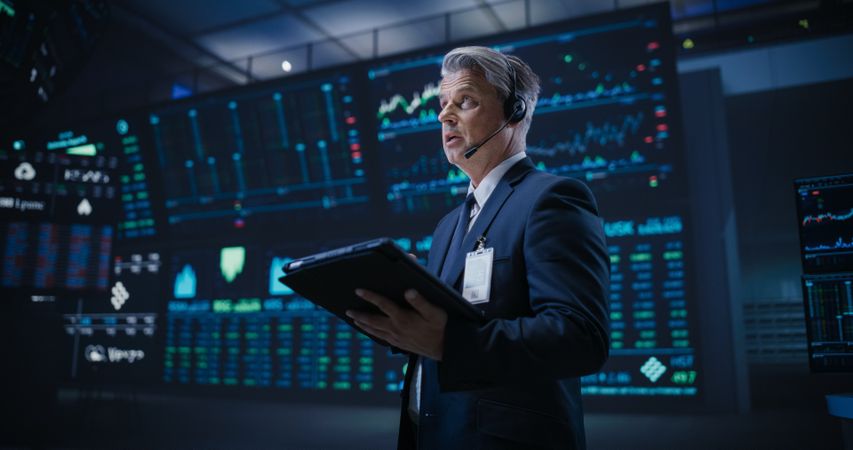 Stockbroker Buying and Selling Shares During Day Trading.