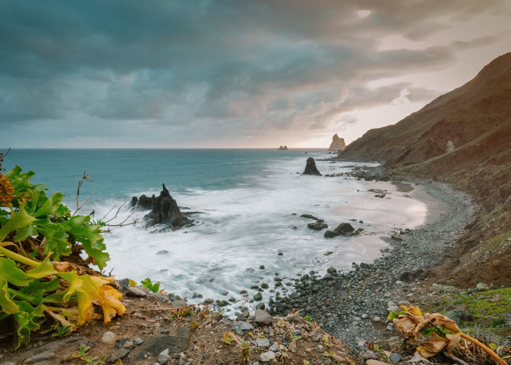 Lonely cliff in sea on cloudy day
