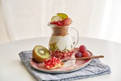 Delicious dessert of yogurt and crumbled granola and fruits