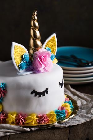 Cute unicorn cake with painted closed eyes