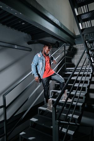 Stylish man Black standing on downstairs in building