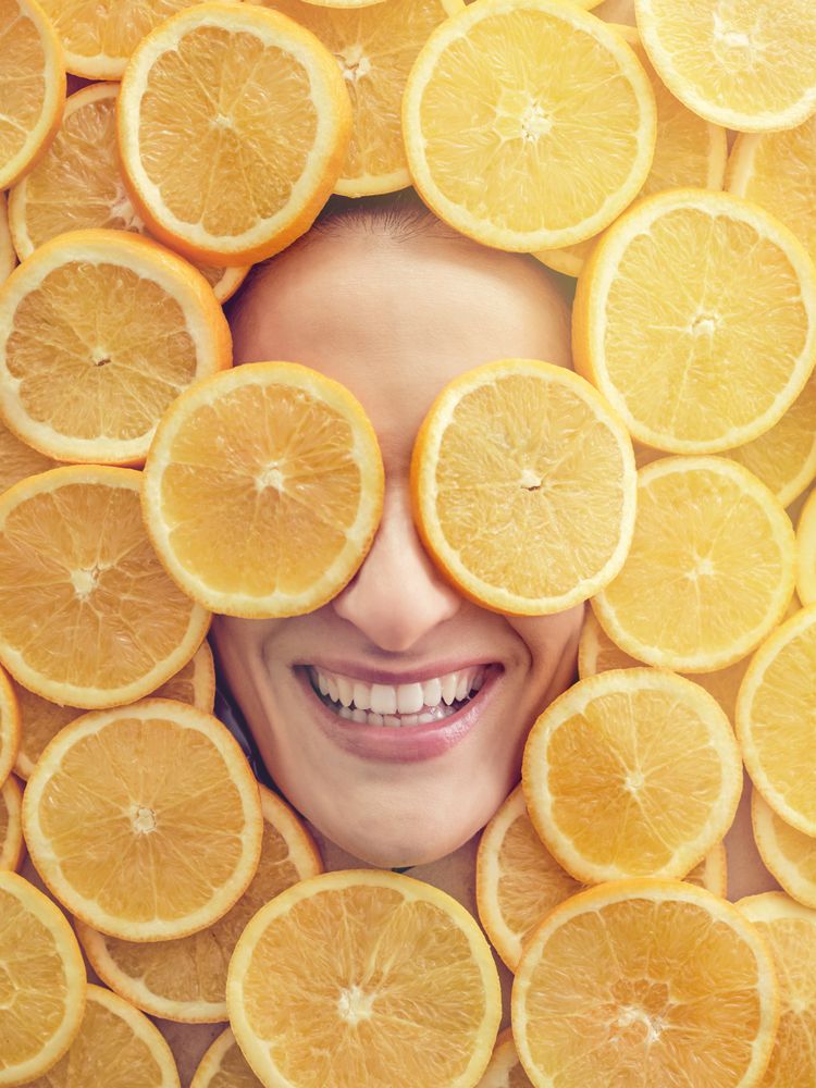 Glad female in orange pieces