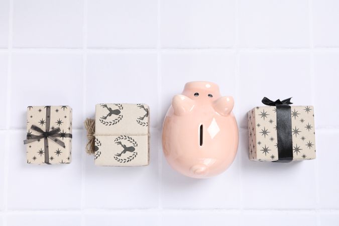 Concept of Christmas finance with piggy bank, top view