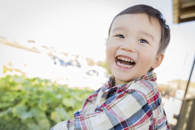 Biracial Young Boy Having Fun Outside