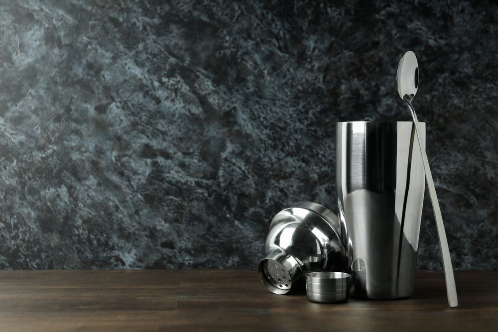 Concept of preparing cocktail, shaker, space for text