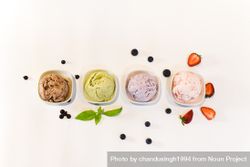 Top view of four small bowls of different flavored ice cream bxZBa5