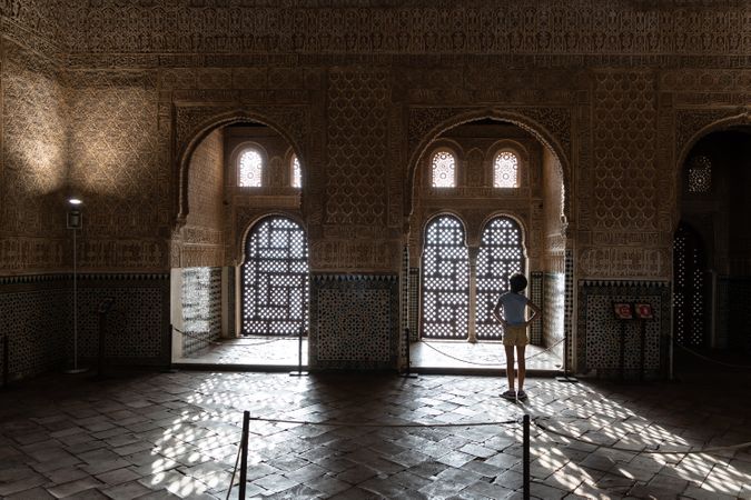 Girl enjoying the light of the Alhambra in Granada