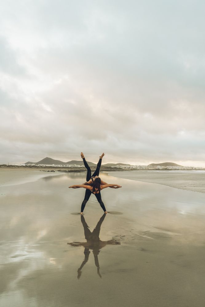 Women exercising near sea