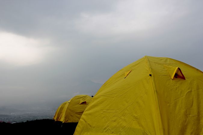 Line of yellow tents on overcast day