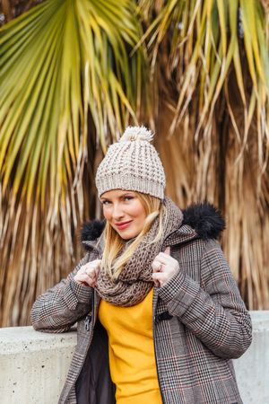 Portrait of blonde woman posing in the city