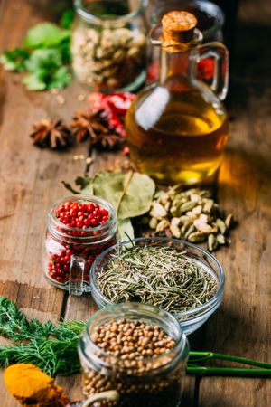 Spices and oil on table