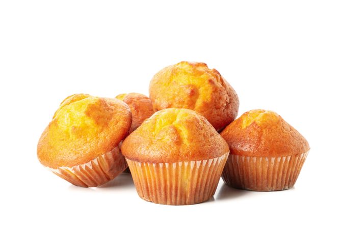 Delicious tasty muffins isolated on light background