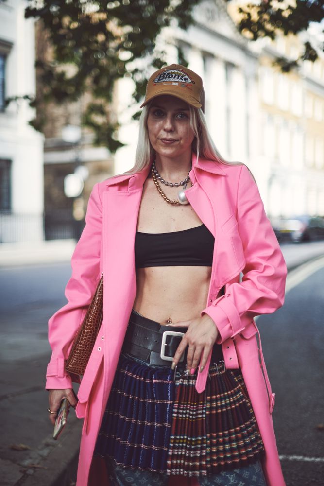 London, England, United Kingdom - September 18 2021: Blonde woman in cap and mini skirt