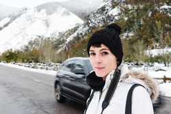 Woman visiting mountains in winter
