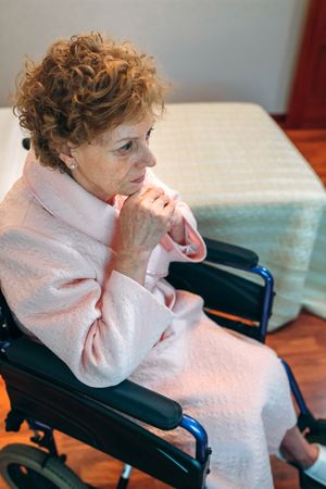 Older woman in a wheelchair alone