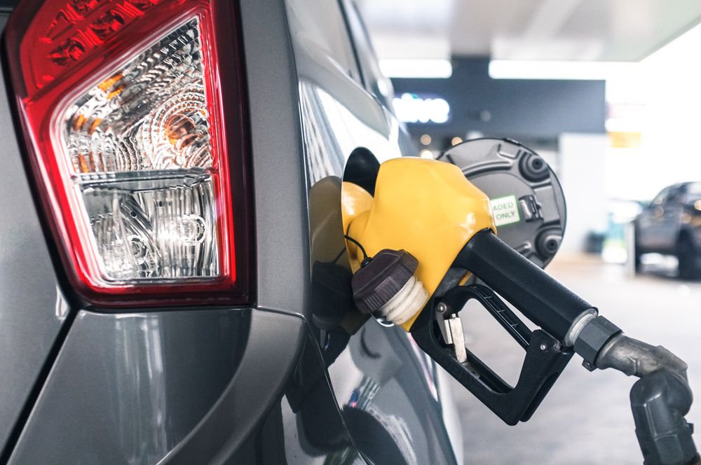 Close up of gas handle filling up vehicle