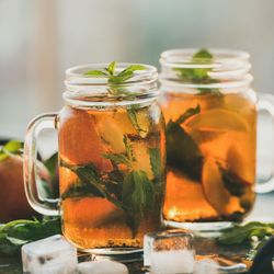 Orange cocktails in mason jars with garnish