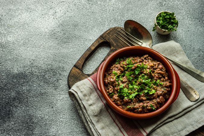 Georgian lobio dish in rustic bowl on kitchen counter