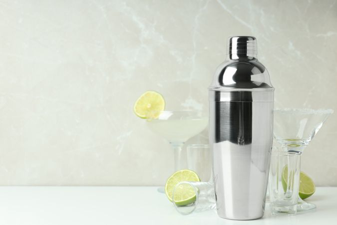 Concept of preparing cocktail, shaker, space for text