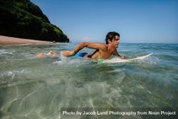 Young man water surfing in ocean 4mWv8X