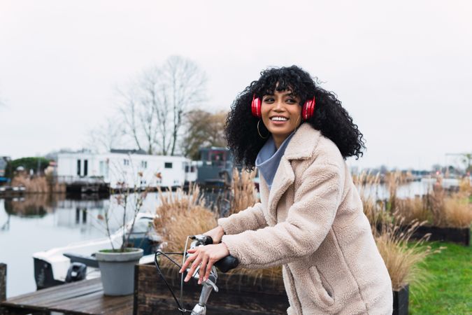 Woman in headphones riding bicycle