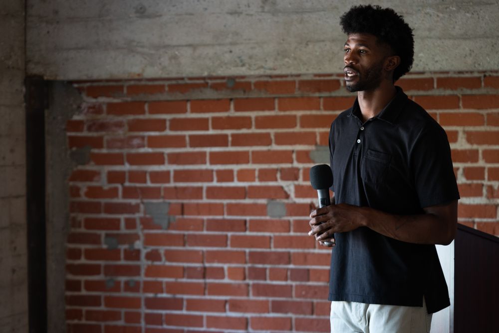 Man public speaking holding a microphone