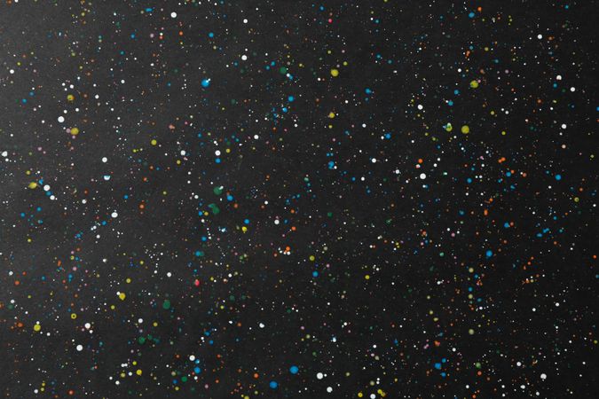 Paint splatters and spots on dark background. Texture for your design