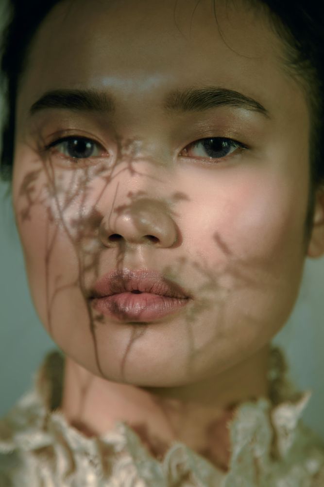 Portrait of East Asian woman with blue eyes