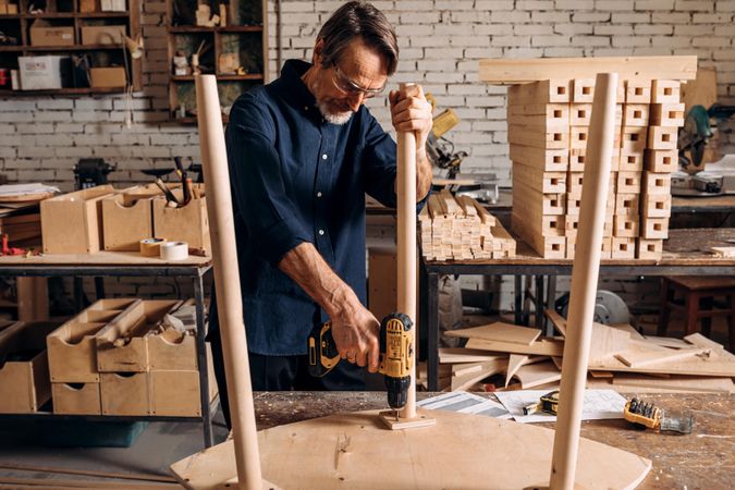 Man building a table in a woodshop