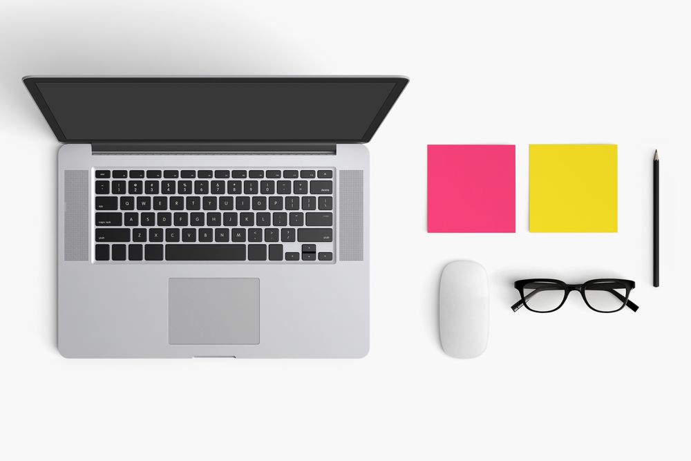 Modern workspace with coffee cup, smartphone, paper, notebook, tablet and laptop copy space