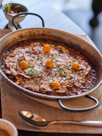 Delicious paella on board on napkin
