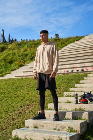 Hispanic sportsman on stairs