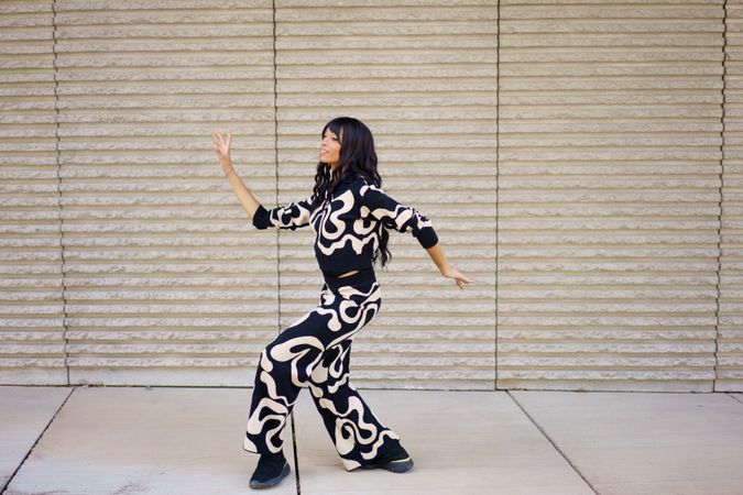 Expressive dancer performing modern movements dancing in the city