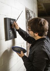 Painter artist working on a oil canvas