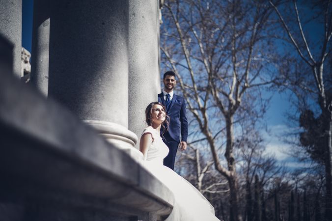 Newlyweds near columns